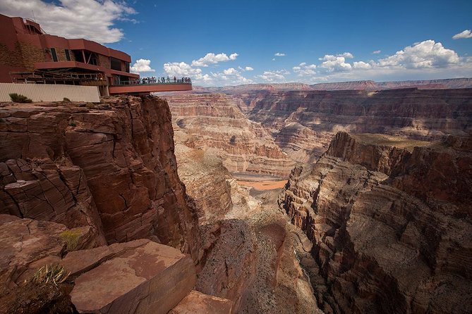 Grand Canyon Helicopter and Western Ranch Adventure Landing Tour - Flying below the Grand Canyon West Rim