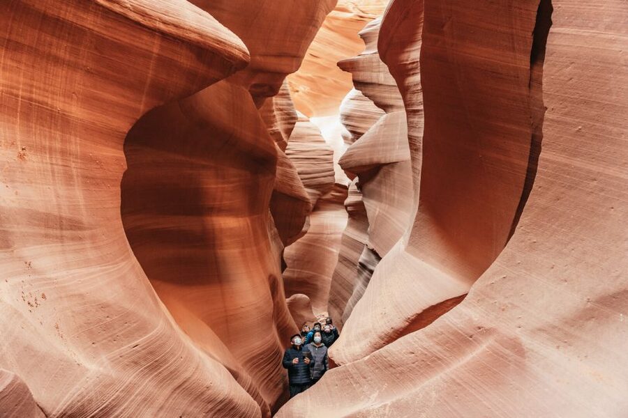 Vegas: Antelope Canyon & Horseshoe Bend Tour at Golden Hour - Walking through Antelope Canyon with a Navajo guide